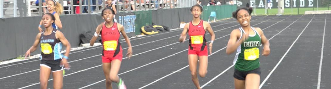 High school girls running in track event