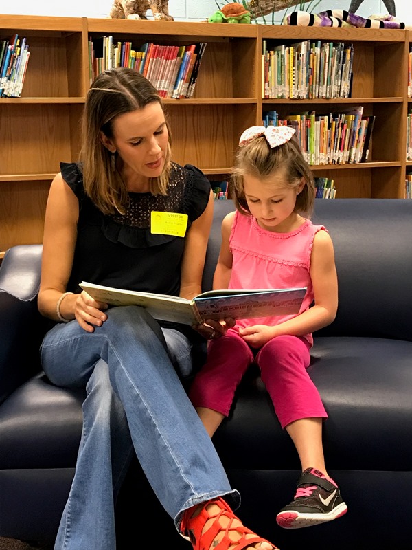 Plain Elementary PTA - PTA mother reading to female student