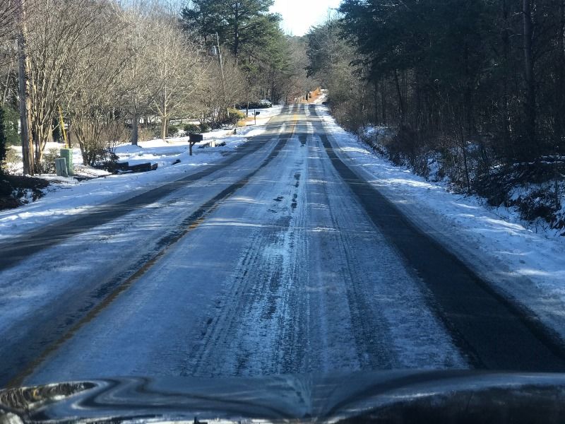 Icy road photographed from dirver's perspective