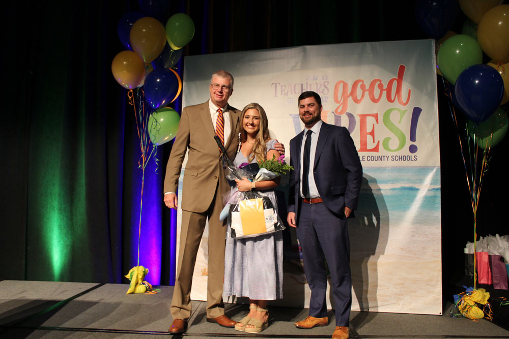 Cait Frederiksen McManaway, Fork Shoals School, pictured with Superintendent Dr. Burke Royster and Phil Barnhill, CFO, Greenville Federal Credit Union 
