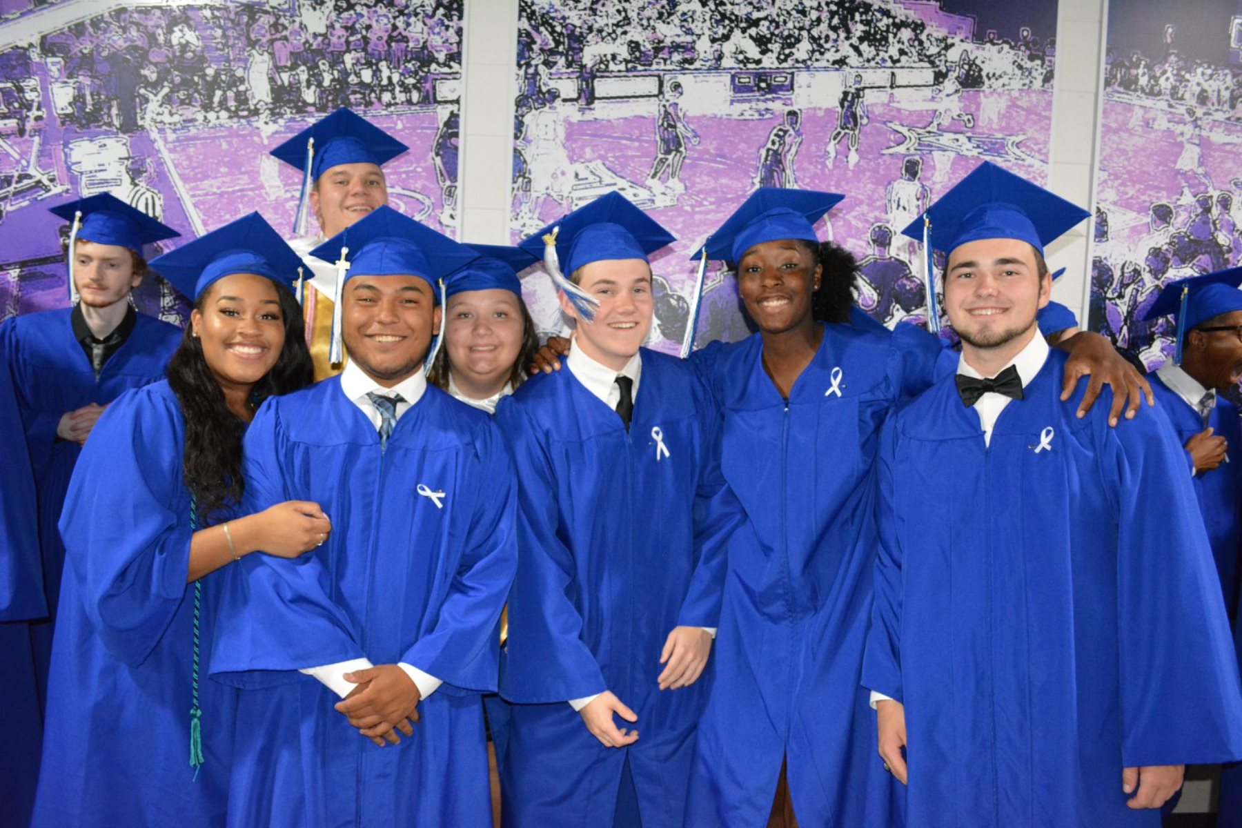 Group of high schools students in graduation regalia