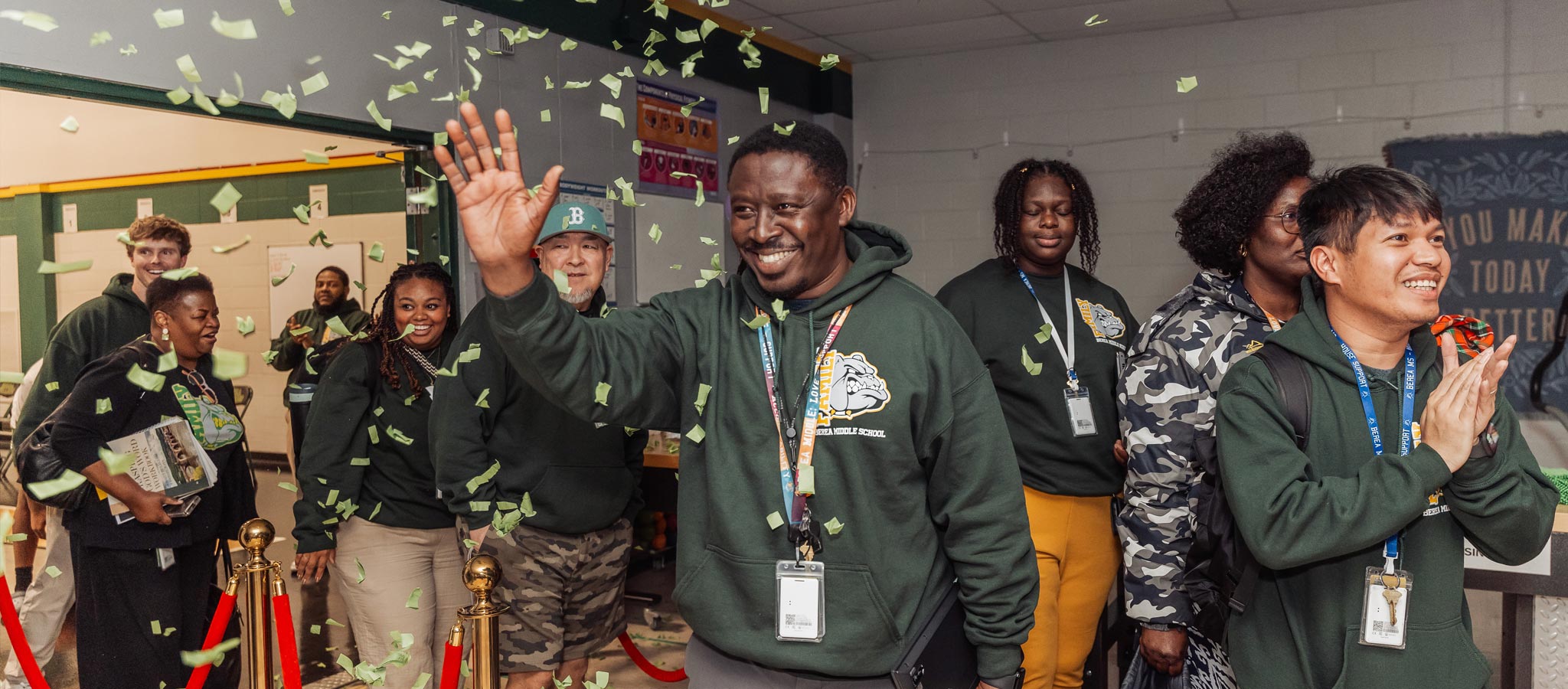 teachers walking into room in celebration