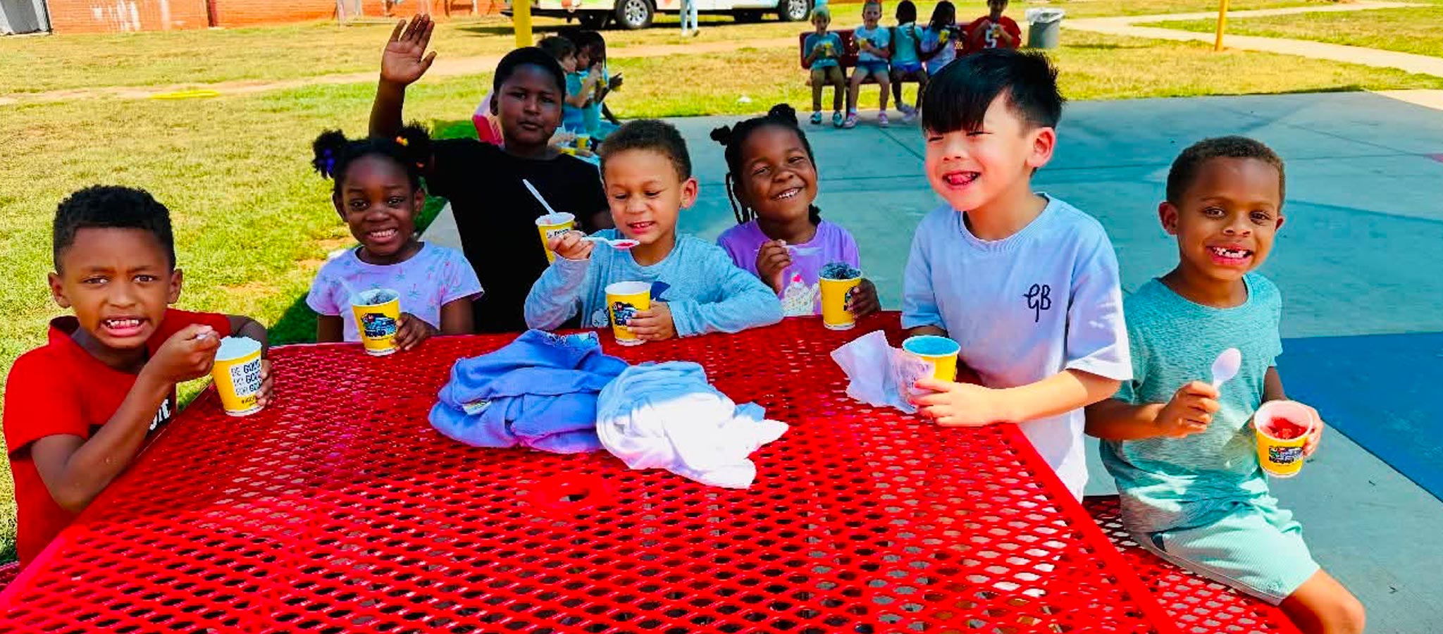 students outside with slushy drinks