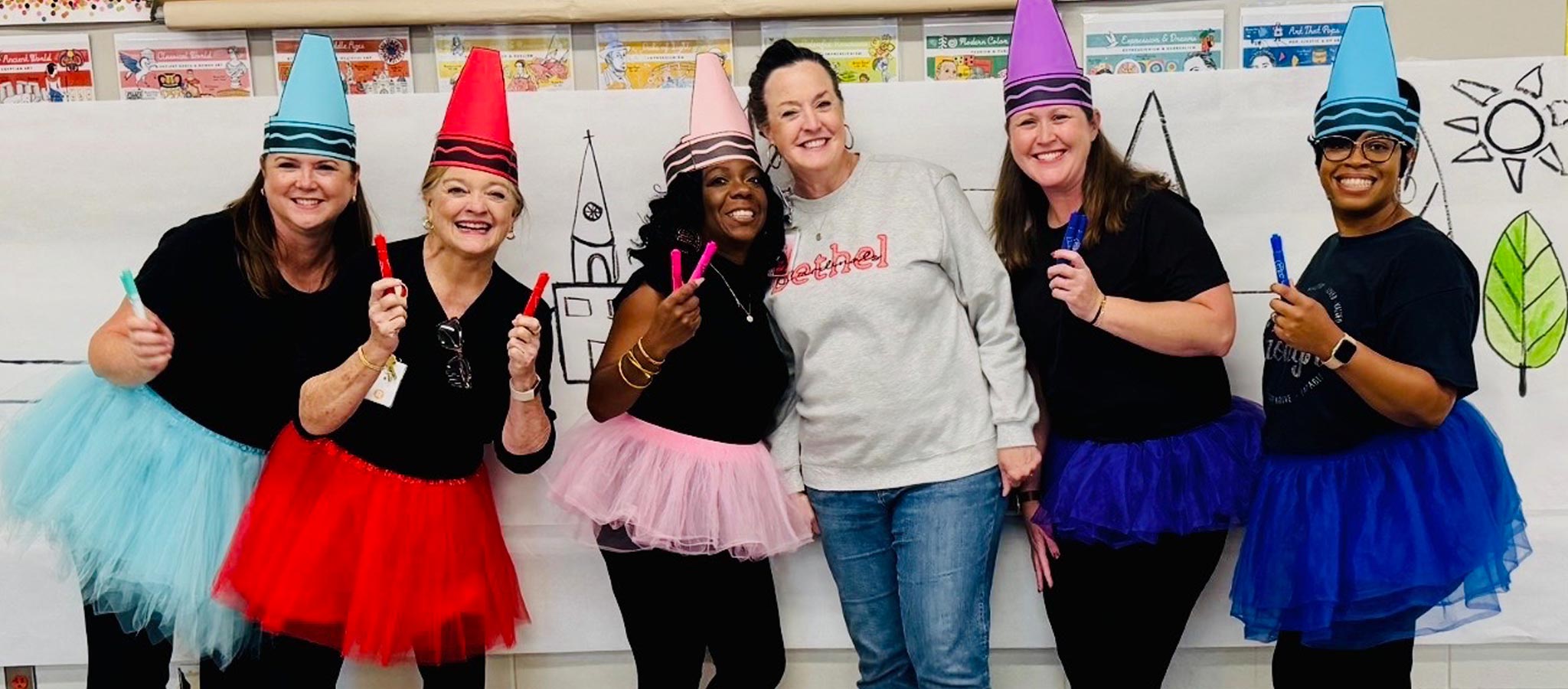 6 staff wearing party attire