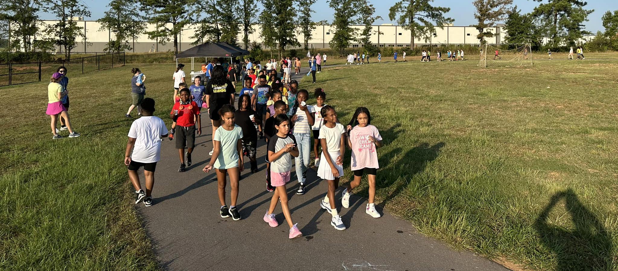 students walking around the track