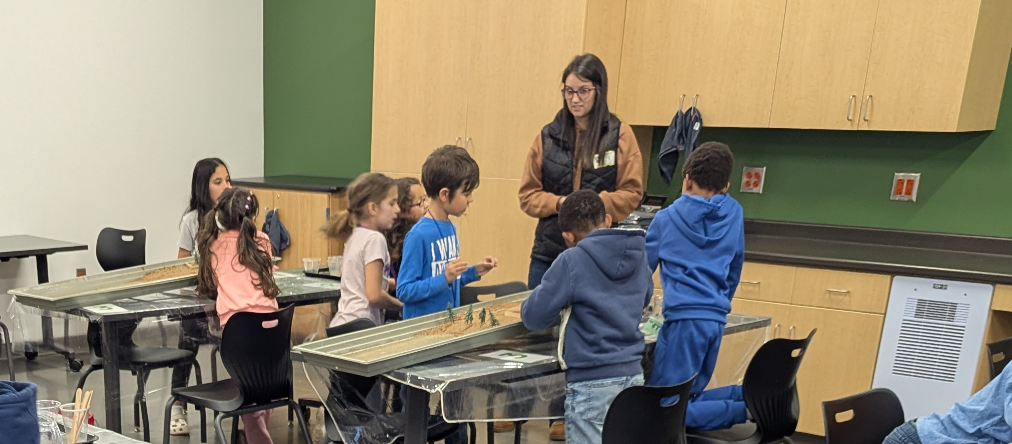 A group of students solving a Roper Mountain Science Center activity.