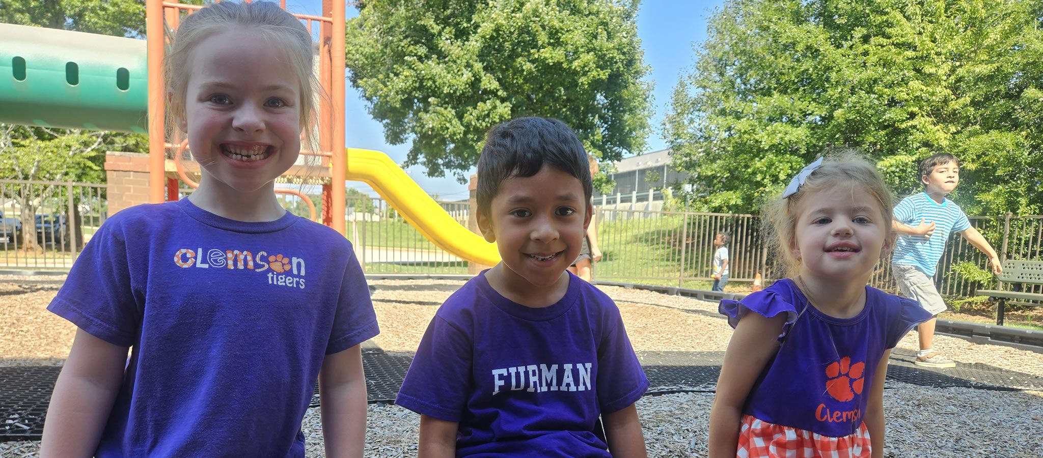 3 Elementary children on playground