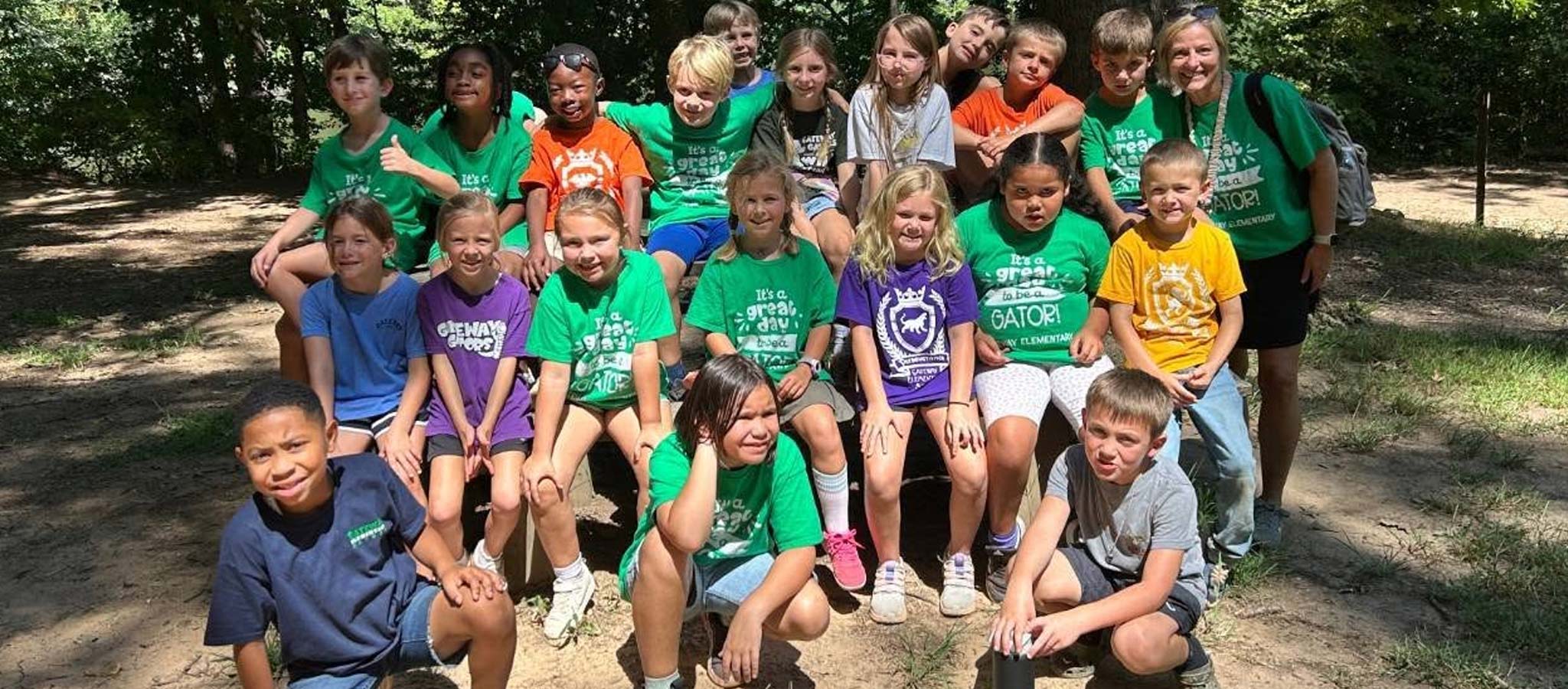 Class of students outside posing in a group photo