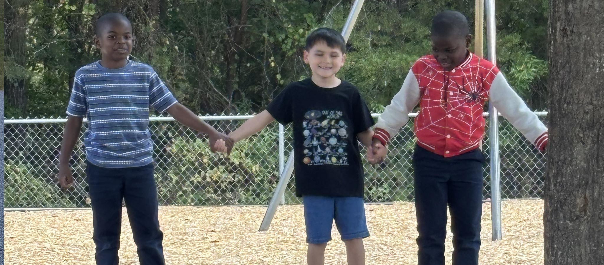 2 boys holding hands