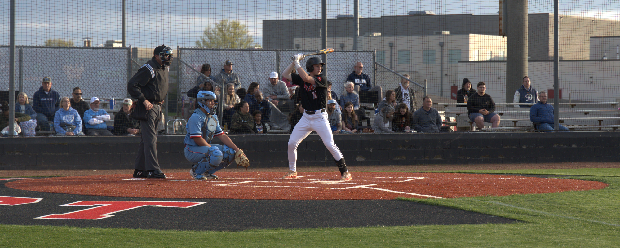 baseball player mid swing