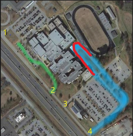 image is an aerial view of HHS with green/blue/red lines indicating driving patterns to be used.