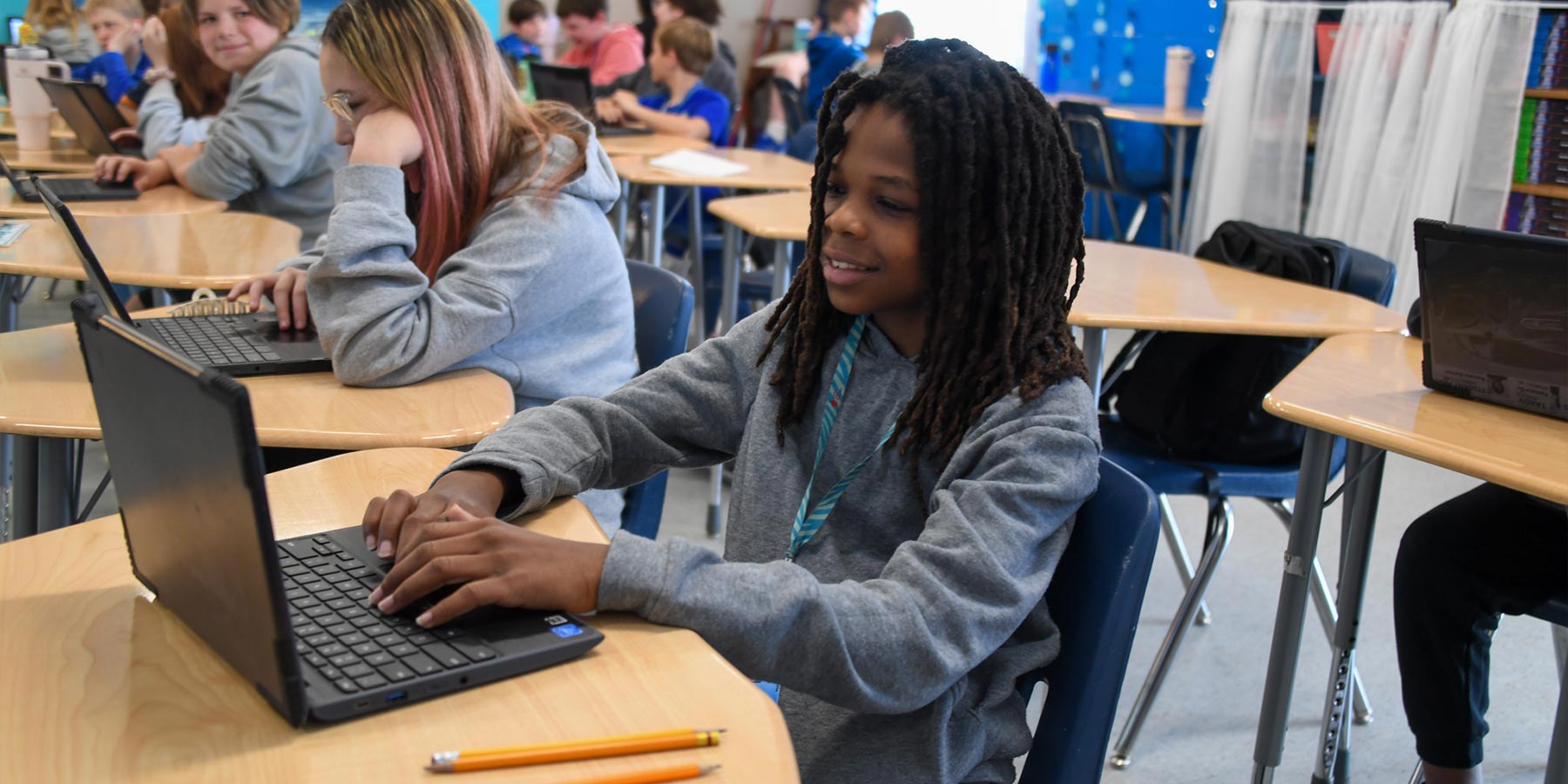 Female student working on laptop computer