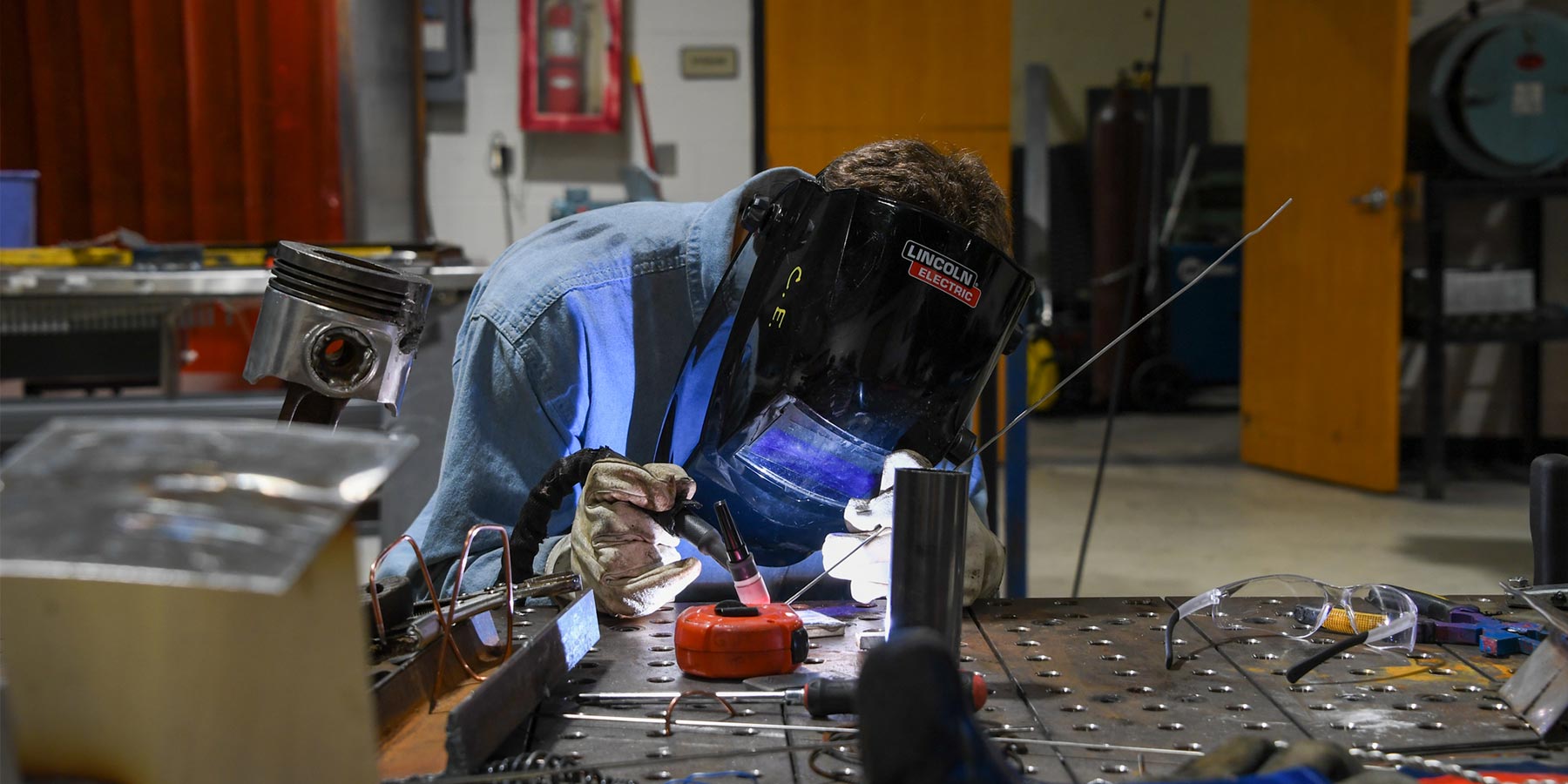 student welding something