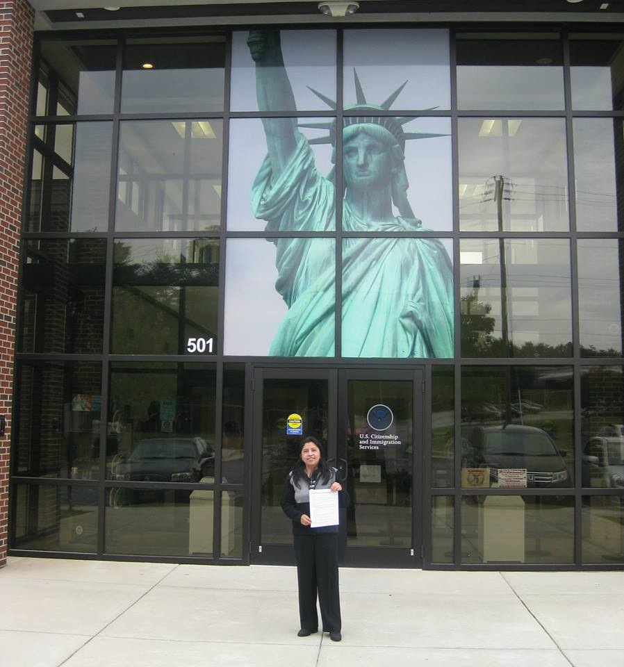 Posing with citizenship papers