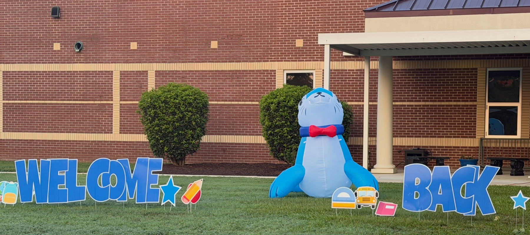 Simpsonville Seal in Front of Building