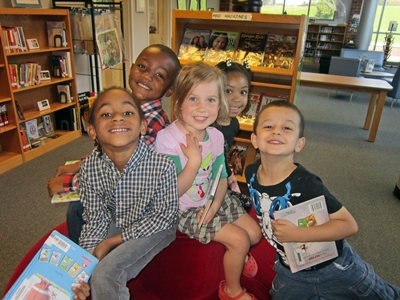 photo of a group of elementary children in a school library