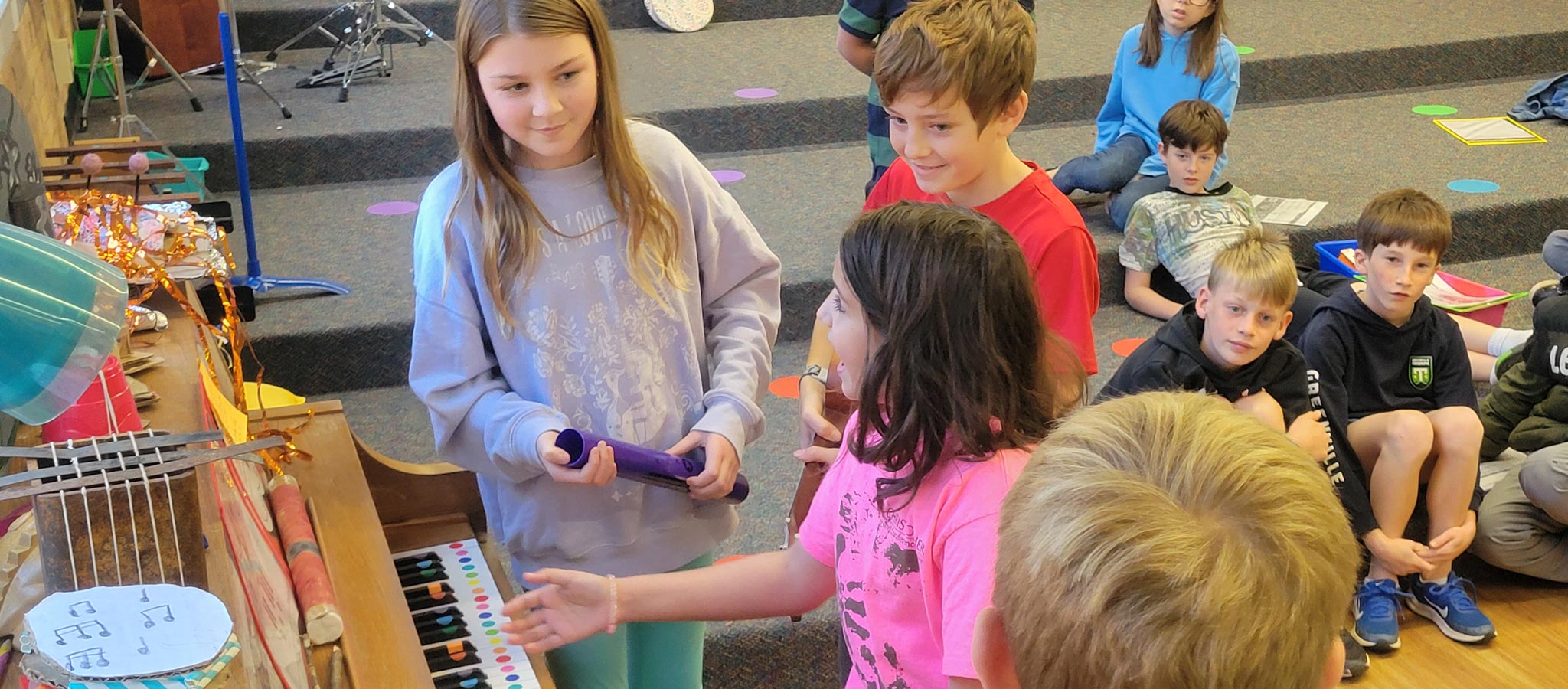 group of students working with music and artwork